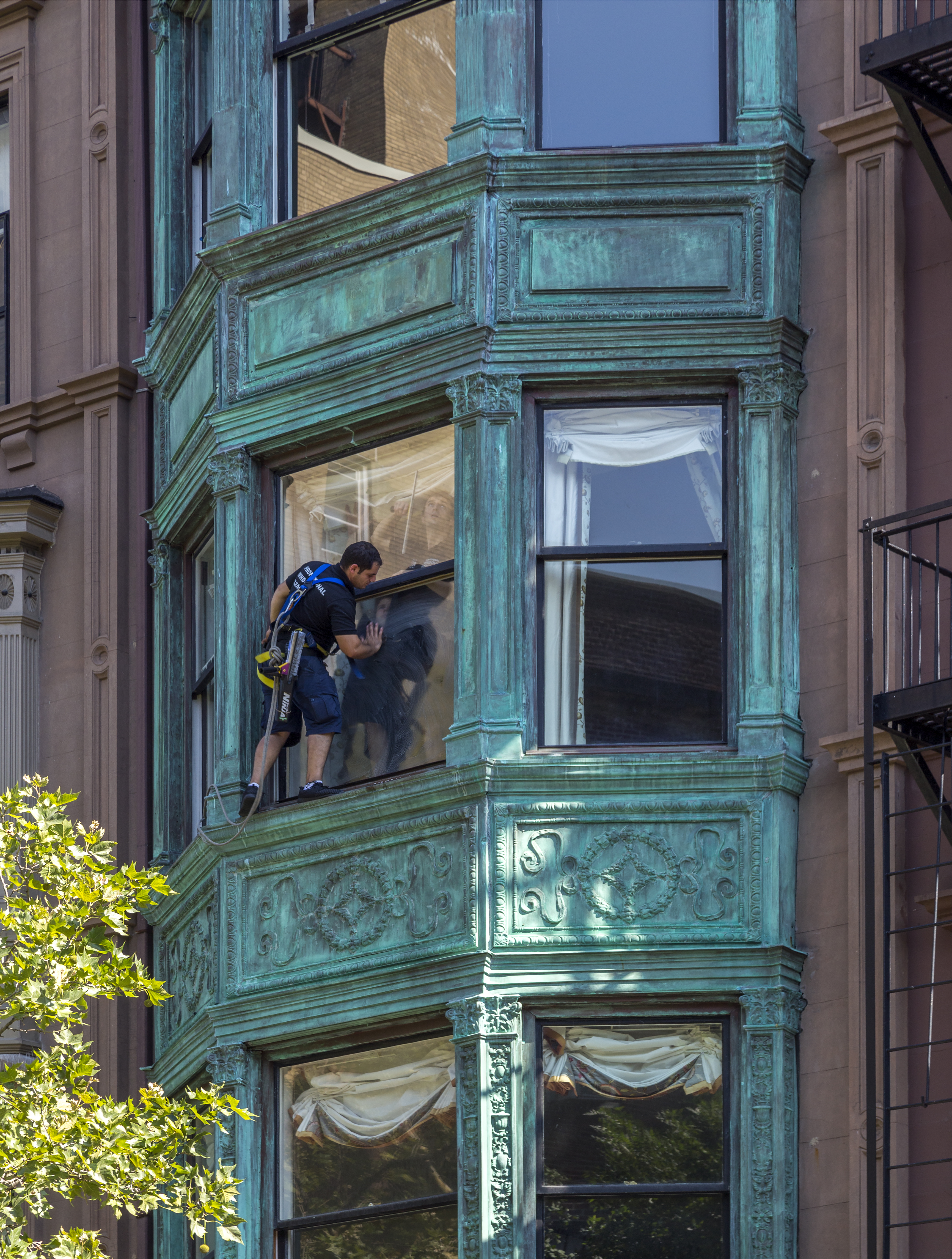 Window washer working on a building in Brooklyn Heights, New York
