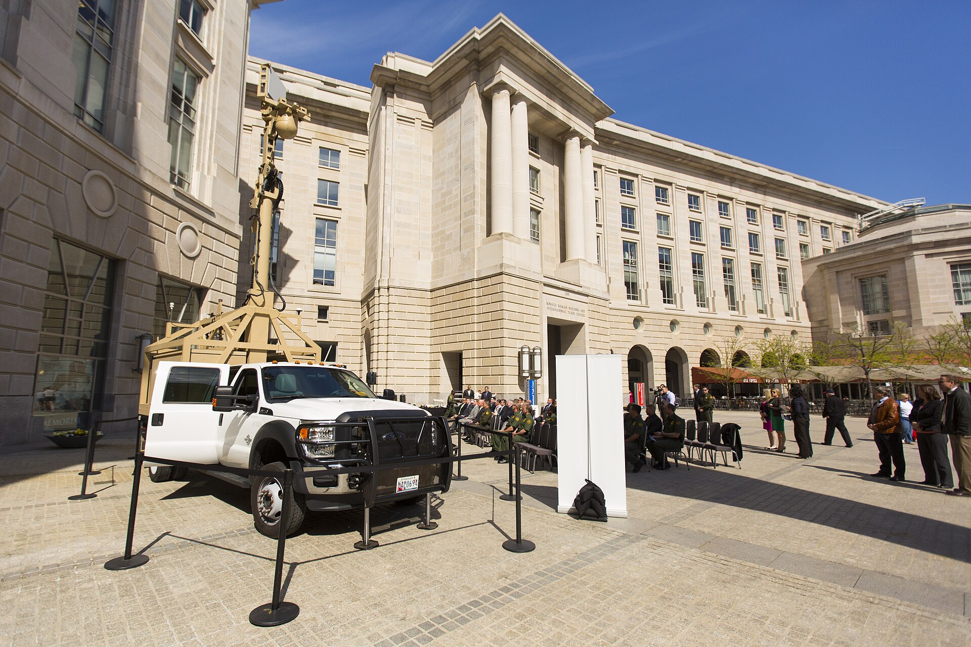 U.S. Customs and Border Protection vehicle handover outside a large government facility