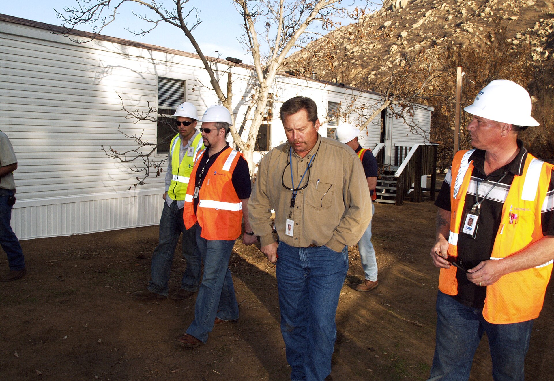Building inspector and contractors walking an active California site